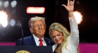 Donald Trump stands with Erika Kirk at the conclusion of a memorial for her husband, conservative activist Charlie Kirk, in Glendale, Arizona, September 21