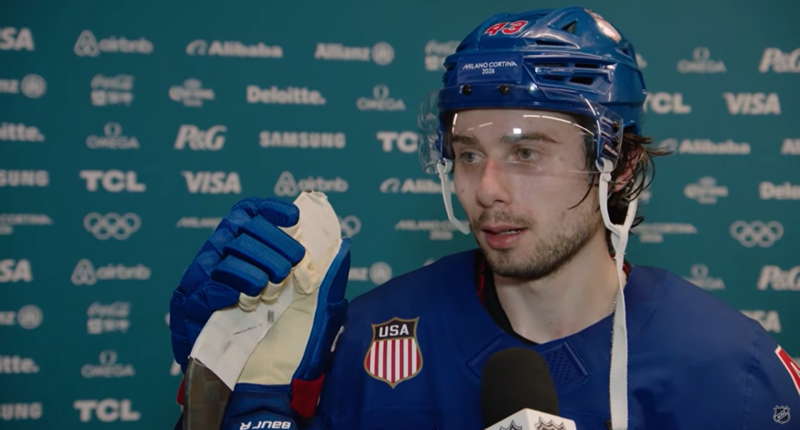 Quinn Hughes speaking to reporters.