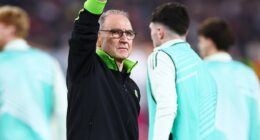Martin O'Neill salutes the away fans after his Celtic side won 1-0 away to Stuttgart