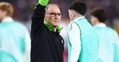 Martin O'Neill salutes the away fans after his Celtic side won 1-0 away to Stuttgart