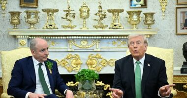 Donald Trump with Ireland's Taoiseach Micheal Martin on Tuesday. The President has said he is 'not afraid' of anything, even sending ground troops to Iran in a Vietnam War-style invasion
