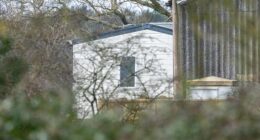 The massive white mobile home has been set up amid a stable block to hide it from view. It is thought to be to house staff after his downsizing from Royal Lodges leaves him wanting more space