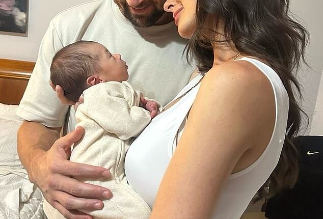Socceroos captain Mat Ryan has revealed why he made the agonising decision to miss the birth of his first child (pictured, with partner Chloe and the couple's baby boy Preston)