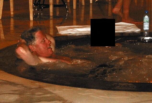 A photograph released in December by the Department of Justice shows Bill Clinton reclining in a hot tub beside a woman whose face was redacted