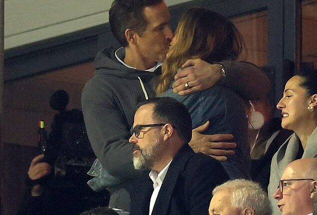 Blake Lively, 38, shared a passionate kiss with husband Ryan Reynolds during a rare joint appearance on Saturday at a soccer match in Wales