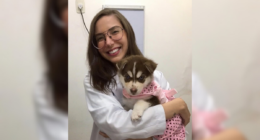 Isadora Borges holding a puppy