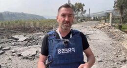 British journalist Steve Sweeney is seen moments before a missile struck the ground just feet behind him in southern Lebanon