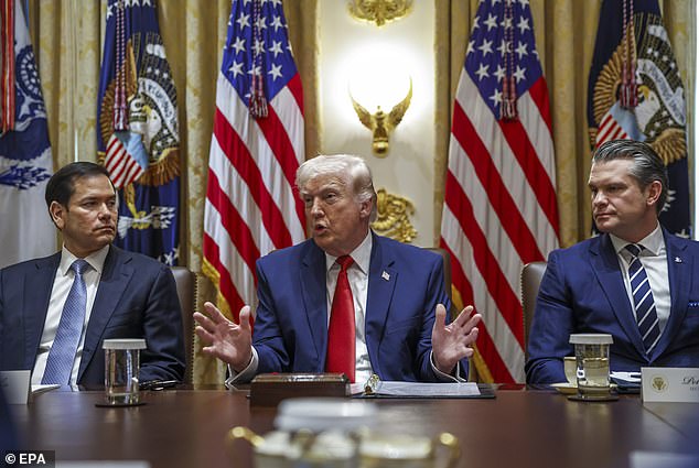 US President Donald J. Trump (C), with Secretary of State Marco Rubio (L) and Secretary of Defense Pete Hegseth (R), responds to a question from the news media during a cabinet meeting