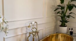 Millie Mackintosh's extensive renovation of her £5million home includes a large, sprawling bathroom fit with high ceilings, a copper bath tub and a spot of greenery