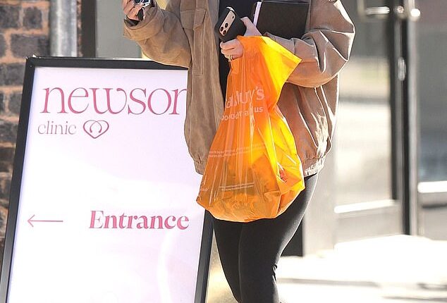 Coleen Rooney has put her wedding ring back on after her husband Wayne was spotted partying with two mystery women