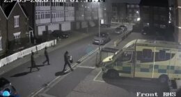 Three hooded suspects were seen approaching the emergency vehicles before they were set alight