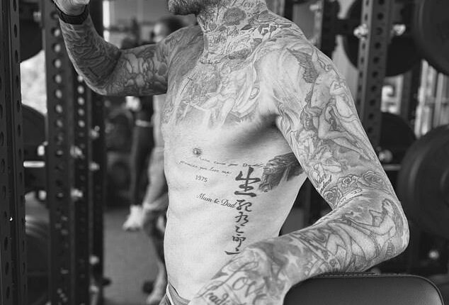 Sir David Beckham showed off his ripped physique and tattoos as he worked out shirtless in his lavish home gym at his £60million Miami mansion on Tuesday