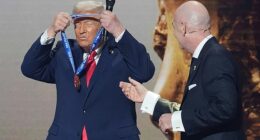 Donald Trump, pictured picking up his peace award from FIFA president Gianni Infantino last December, insists he 'does not care' if Iran play at the World Cup