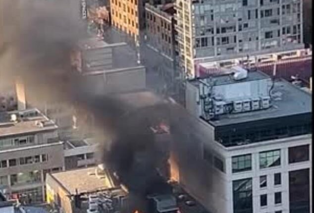 Thick black smoke could be seen billowing across the skyline on Friday evening forcing emergency crews to lock down surrounding streets