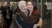 Isabel Robertson (pictured), 29, of Windsor was greeted with a hug from mother Alba as she landed on Monday