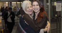 Isabel Robertson (pictured), 29, of Windsor was greeted with a hug from mother Alba as she landed on Monday
