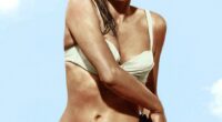 In an unforgettable white bikini and with a dagger on her hip, Ursula Andress's appearance (pictured in 1962) on a gleaming Jamaican beach in Dr No set the standard for every Bond girl