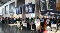 Frightened holidaymakers and British nationals scramble for flights home. Pictured: Dubai airport this week. Pictured: Passengers wait at Muscat International Airport