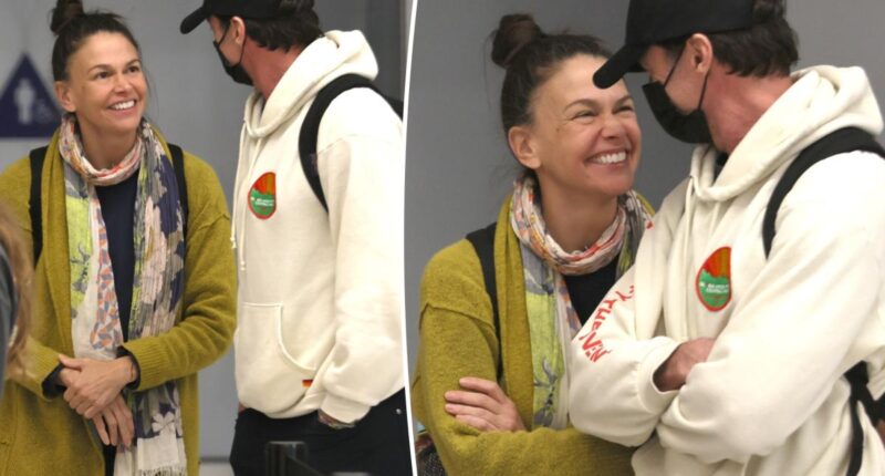 Hugh Jackman and Sutton Foster look more in love than ever while arriving at LAX