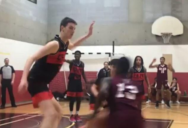 March Madness giant Olivier Rioux is seen towering over rivals in footage from high school