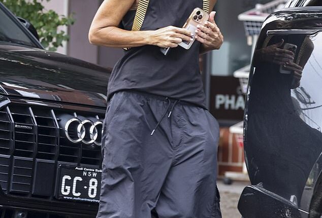 Jackie 'O' Henderson paid a secret visit to a leading commercial radio network in the UK last year - months before her sensational exit from The Kyle and Jackie O Show. (She is seen visiting a beauty salon in Sydney's east on Monday)