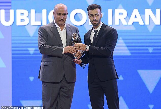 Mehdi Taj (left) has said Iran may not compete in this summer's 'inappropriate' World Cup