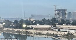 Smoke rises following a drone attack on the US embassy in Baghdad on March 14, 2026. A drone struck the US embassy in Baghdad on March 14, an Iraqi security official said, as an AFP journalist saw smoke rising from the complex. (Photo by AFP via Getty Images)
