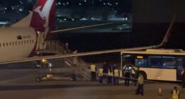 The Iranian women's soccer team have left Australia (pictured are the women disembarking a flight from the Gold Coast to Sydney)