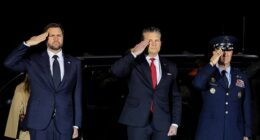 JD Vance (pictured left) oversaw the dignified transfer of the seventh US service member to die in the Iran war after Donald Trump admitted his vice president is 'less enthusiastic' about the conflict