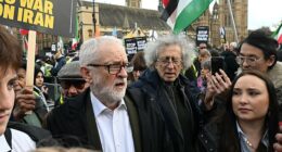 Jeremy Corbyn (centre left) was seen with his brother Piers (centre right) alongside supporters of the regime at a rally in Parliament Square on Saturday