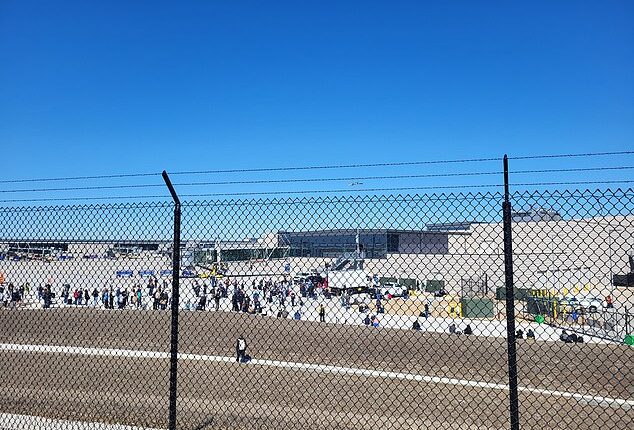 Confused and terrified passengers were seen dragging their bags out of the airport and onto the tarmac as all flights were grounded out of the Midwest hub