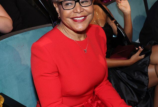 Mayor Karen Bass, pictured above on February 28 at the NAACP Image Awards, signed a controversial wage increase into law last year for hotel workers