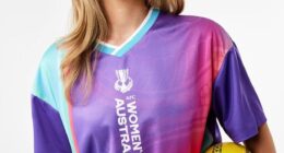 Kmart has apologised after its merchandise error infuriated Matildas fans ahead of the Asian Cup (pictured, a model in a Tillies jersey while holding an AFL Sherrin match-day ball)