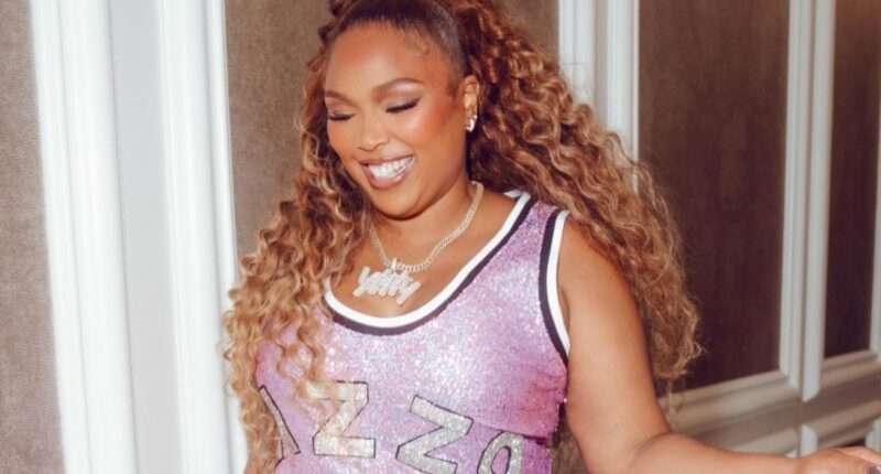 Lizzo flaunts staggering 60-pound weight loss in sparkly pink minidress