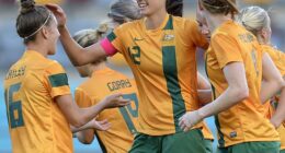 Former Matildas star Kate Gill (pictured, middle) has labelled women's football at international level a 'rigged game' - and then slammed the lack of prize money on offer at the Asian Cup