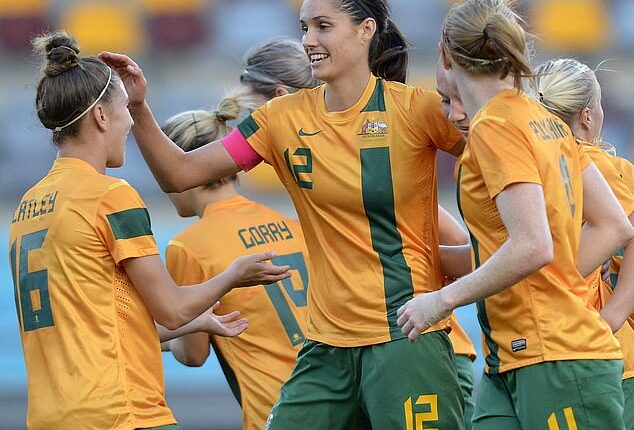 Former Matildas star Kate Gill (pictured, middle) has labelled women's football at international level a 'rigged game' - and then slammed the lack of prize money on offer at the Asian Cup