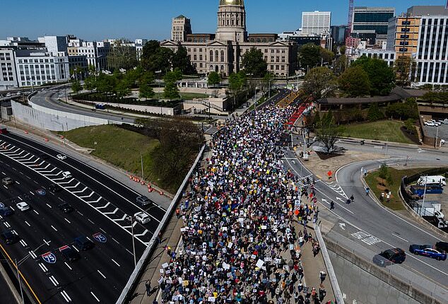 Millions gathered coast to coast on Saturday for coordinated 'No Kings' demonstrations against President Donald Trump (Georgia)