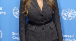 The 55-year-old looked powerful in a matching grey skirt-suit, featuring a tailored blazer with a matching skirt