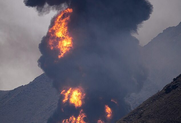 A huge fire is seen after an Iranian drone attack on a major oil facility in Fujairah, UAE on Saturday