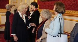 Queen Camilla speaks with Miriam Margolyes during a St James's Palace reception yesterday