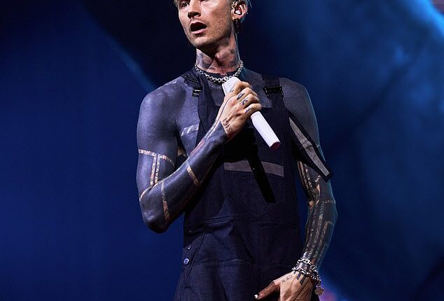 A Machine Gun Kelly fan suffered a mortifying moment after falling through a hole in the stage during the rapper's London concert on Thursday (seen above)