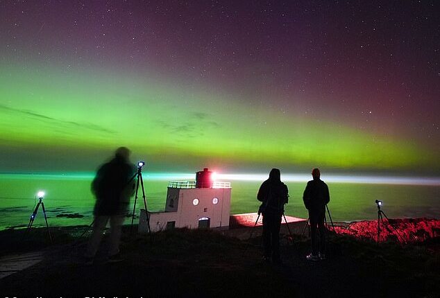 Photographers and stargazers watched the Northern Lights in Northumberland on Friday