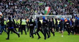 Supporters spill on to the Ibrox pitch during Sunday's controversial Old Firm clash