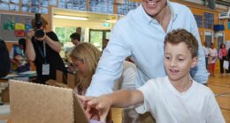 SA Premier Peter Malinauskas voting with his family at Woodville Gardens School during the South Australian state election on Saturday