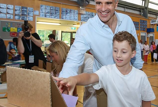 SA Premier Peter Malinauskas voting with his family at Woodville Gardens School during the South Australian state election on Saturday