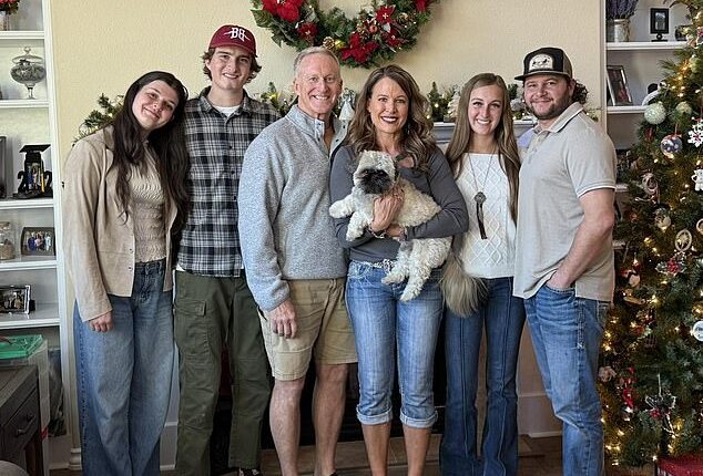 Melissa Graham, seen with her family, is being sued for allegedly embezzling hundreds of thousands of dollars from her former employer