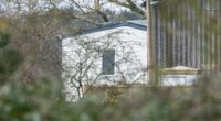The massive white mobile home has been set up amid a stable block to hide it from view. It is thought to be to house staff after his downsizing from Royal Lodges leaves him wanting more space