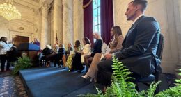 Housewives cast members from various franchises listen to Wisconsin Democrat Senator Tammy Baldwin speak