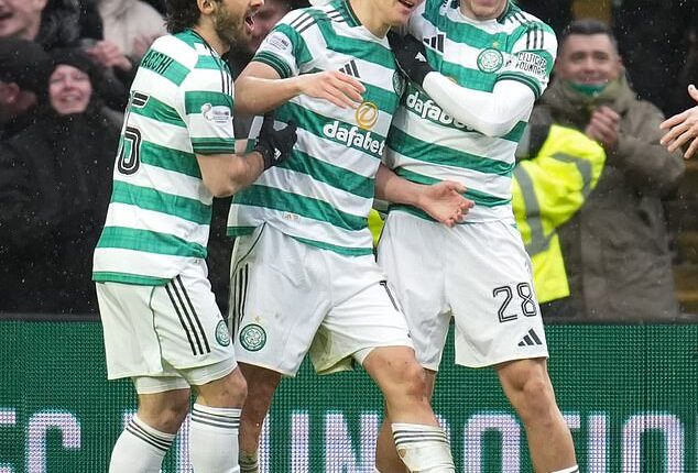 Yang feels the love from his Celtic team-mates after scoring twice against Motherwell