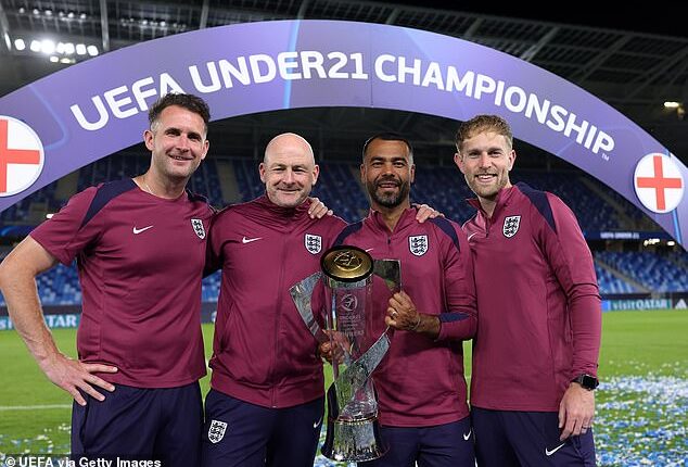 Ashley Cole and Lee Carsley, with goalkeeping coach Tim Dittmer (left) and senior performance analyst James Ryder (right), celebrate the U21 Euros win last summer